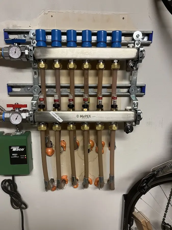 Plumber performing Water Heater Repair at a residential property in Cornwall